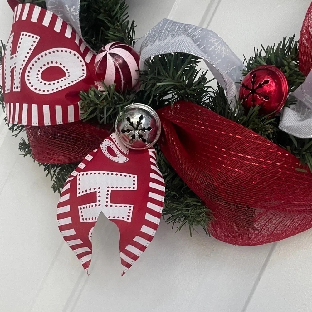 Handmade Christmas wreath, ribbon,bells, and ornaments. Silver, white and red
